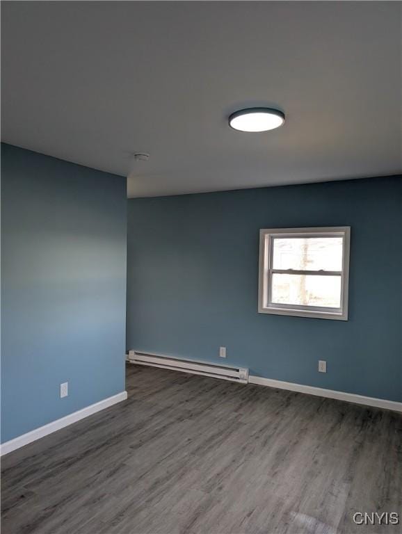 145 Creamery Rd Unit B, Scriba, NY 13126 - unfurnished room featuring wood finished floors, a baseboard radiator, and a smoke detector