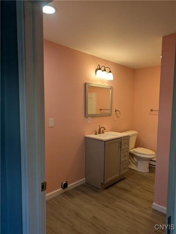 145 Creamery Rd Unit B, Scriba, NY 13126 - bathroom featuring vanity and wood finished floors
