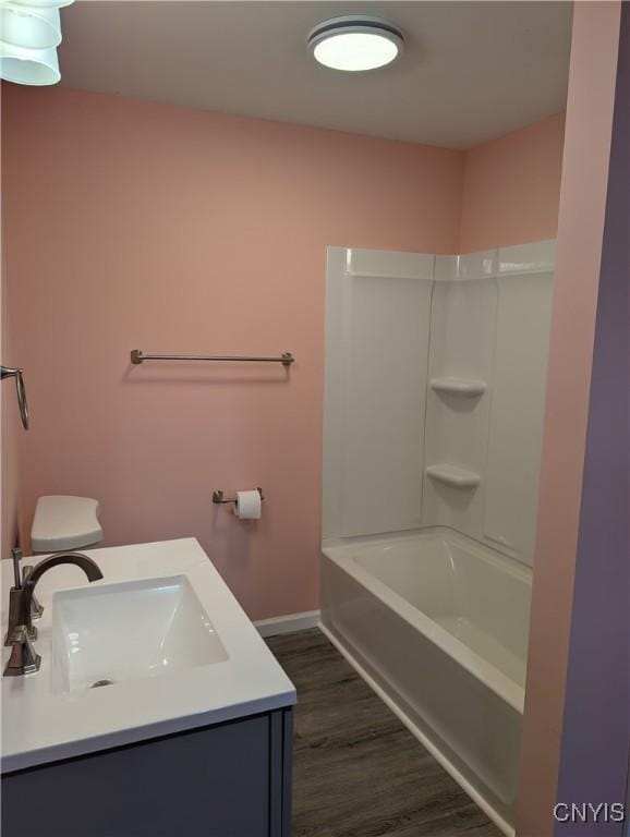 145 Creamery Rd Unit B, Scriba, NY 13126 - bathroom featuring wood finished floors, vanity, and shower / washtub combination