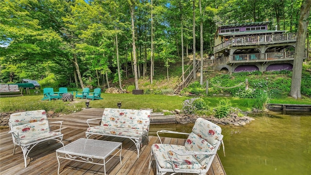 8567 Glen Rd, Rushford, NY 14777 - wooden deck featuring an outdoor fire pit, stairway, and a water view