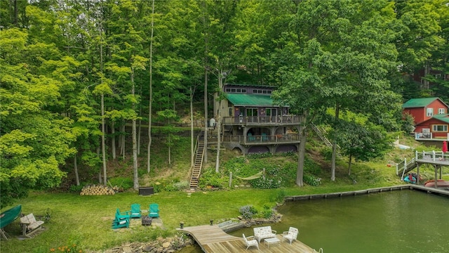 8567 Glen Rd, Rushford, NY 14777 - view of playground featuring stairs, a boat dock, a deck with water view, and a lawn