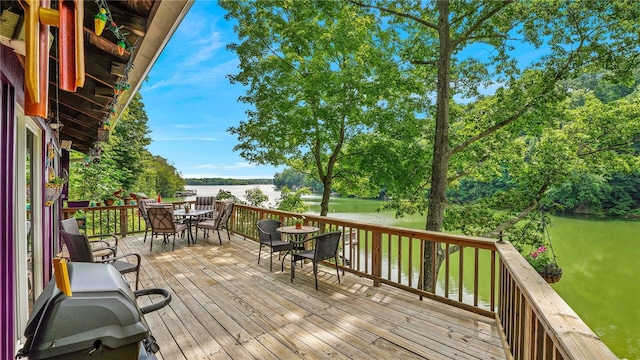 8567 Glen Rd, Rushford, NY 14777 - deck featuring outdoor dining space, a water view, and view of wooded area