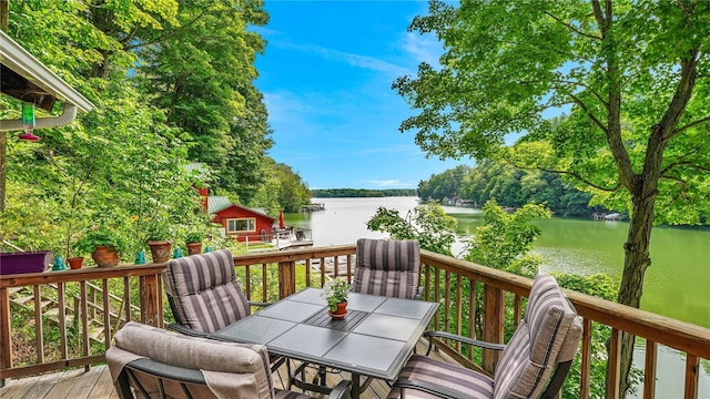 8567 Glen Rd, Rushford, NY 14777 - wooden terrace with a water view and outdoor dining space
