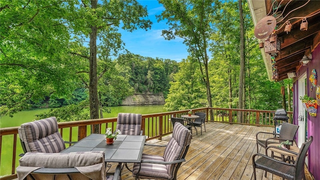 8567 Glen Rd, Rushford, NY 14777 - wooden terrace featuring outdoor dining space, a water view, and area for grilling