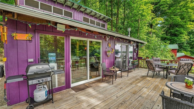 8567 Glen Rd, Rushford, NY 14777 - wooden deck featuring outdoor dining space and area for grilling