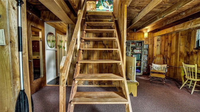 8567 Glen Rd, Rushford, NY 14777 - stairs with wooden walls, carpet flooring, and wood ceiling