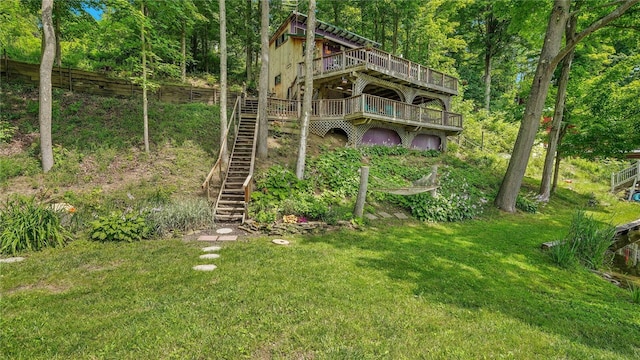 8567 Glen Rd, Rushford, NY 14777 - view of grassy yard featuring stairs, a wooden deck, and a view of trees