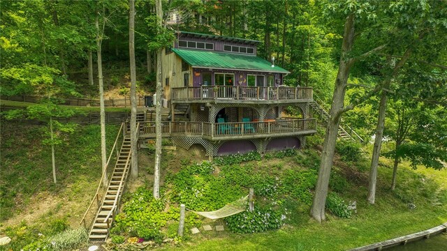 8567 Glen Rd, Rushford, NY 14777 - rear view of house featuring stairway, a wooden deck, and a metal roof