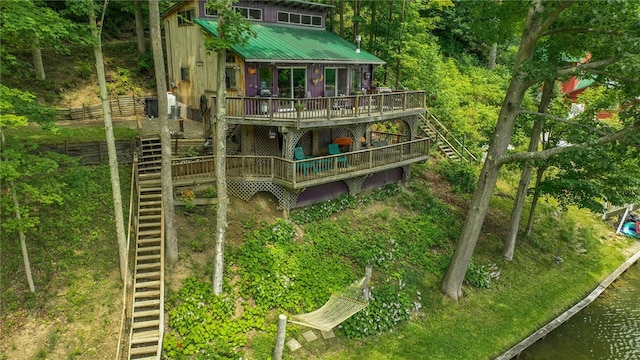 8567 Glen Rd, Rushford, NY 14777 - back of house featuring stairs, a deck with water view, and a metal roof