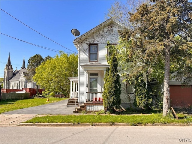 711 Stevens St, Utica, NY 13502 - view of front of house featuring covered porch