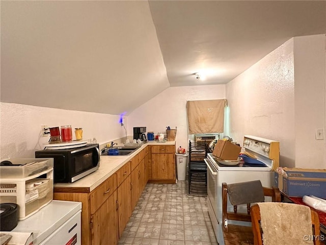 711 Stevens St, Utica, NY 13502 - kitchen with white electric range oven, light countertops, and vaulted ceiling