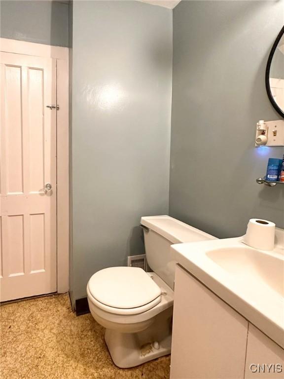 711 Stevens St, Utica, NY 13502 - half bathroom with vanity and toilet