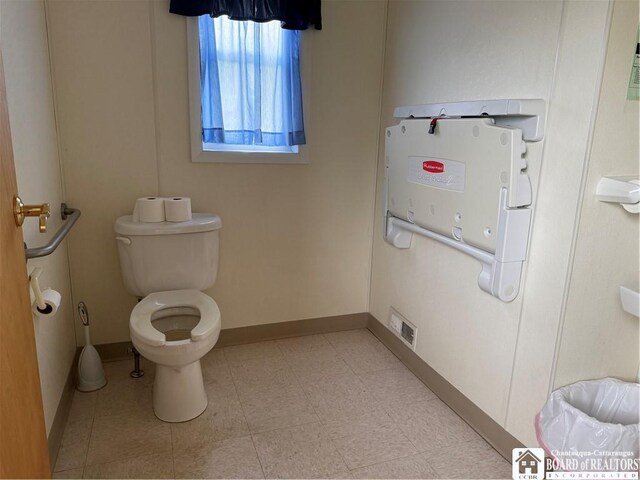 540 W Creek Rd, Owego, NY 13827 - bathroom featuring toilet and baseboards