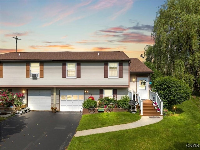 7094 Ourteds Cir, Clay, NY 13090 - view of front of house featuring asphalt driveway, an attached garage, a yard, and cooling unit