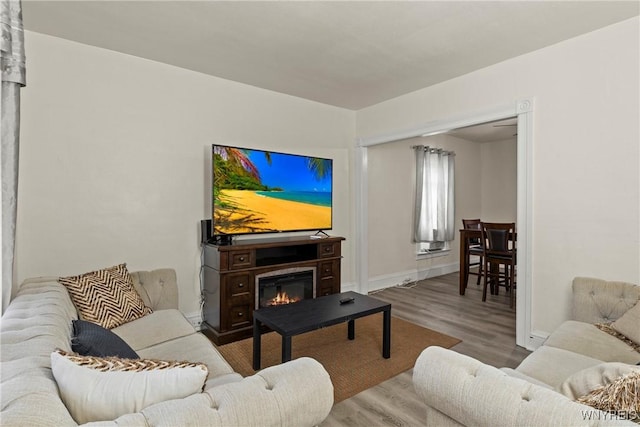 1812 18th St, Niagara Falls, NY 14305 - living room with wood finished floors and a glass covered fireplace