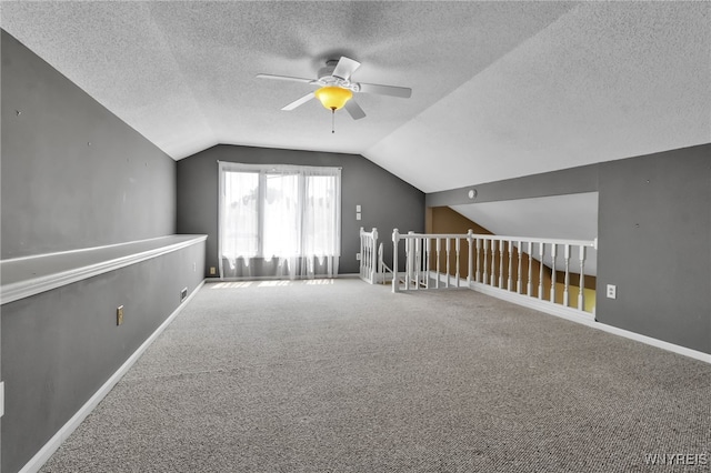 5 Keph Dr Unit 8, Amherst, NY 14228 - bonus room with a ceiling fan, vaulted ceiling, a textured ceiling, and carpet flooring