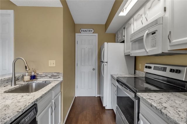 5 Keph Dr Unit 8, Amherst, NY 14228 - kitchen featuring white appliances, dark wood-type flooring, white cabinets, and light stone counters