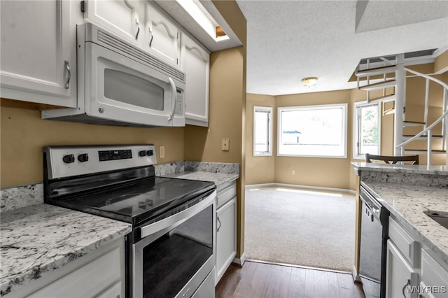 5 Keph Dr Unit 8, Amherst, NY 14228 - kitchen with stainless steel appliances, dark wood finished floors, white cabinetry, and light stone counters