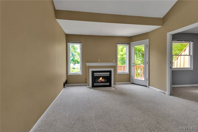 5 Keph Dr Unit 8, Amherst, NY 14228 - unfurnished living room featuring a fireplace with flush hearth and light colored carpet