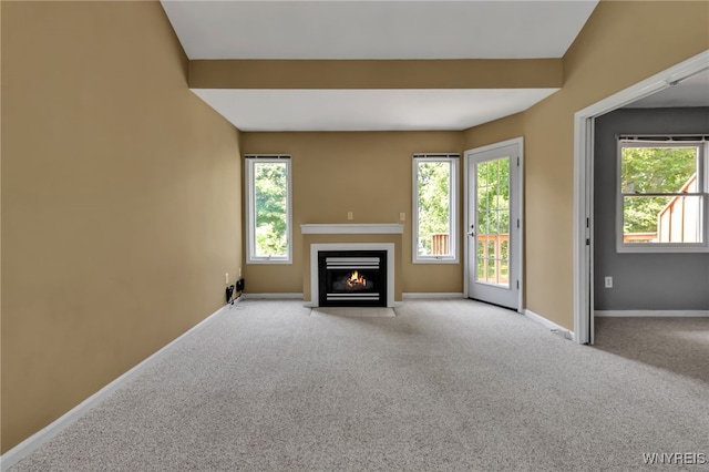 5 Keph Dr Unit 8, Amherst, NY 14228 - unfurnished living room featuring a fireplace with flush hearth and carpet floors