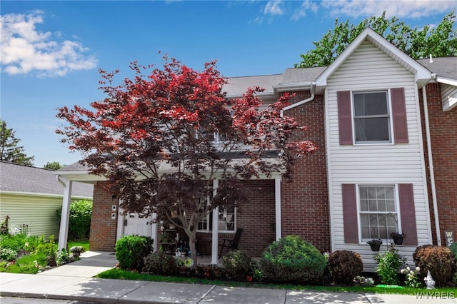 5 Keph Dr Unit 8, Amherst, NY 14228 - view of front of house with brick siding and a porch