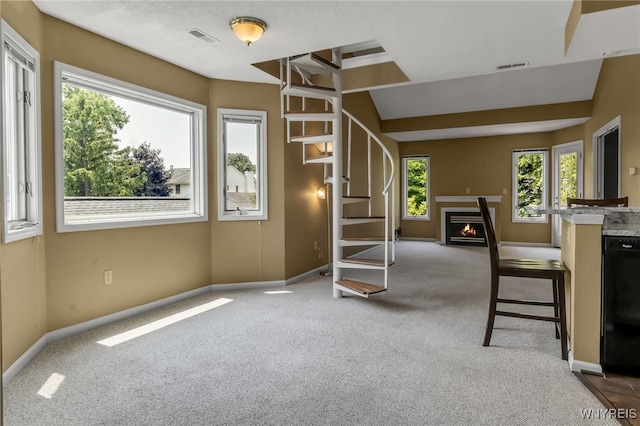 5 Keph Dr Unit 8, Amherst, NY 14228 - interior space featuring carpet flooring, a lit fireplace, and stairs