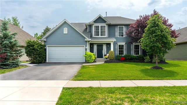 127 Boxelder Ln, Amherst, NY 14228 - traditional-style home with driveway, a front yard, an attached garage, and a shingled roof
