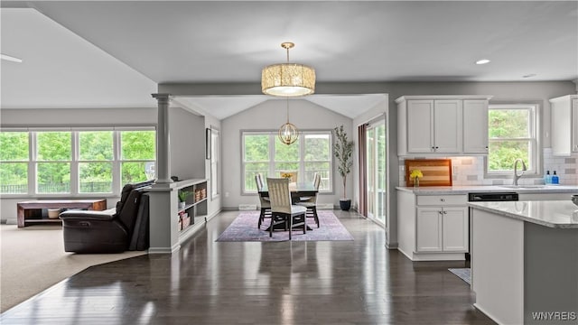 127 Boxelder Ln, Amherst, NY 14228 - kitchen with white cabinets, dark wood-type flooring, pendant lighting, tasteful backsplash, and lofted ceiling