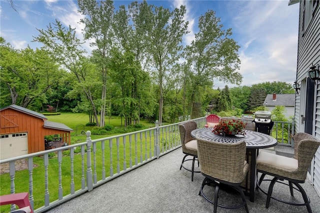 38 E Ave, Murray, NY 14470 - view of patio / terrace with an outbuilding, view of scattered trees, outdoor dining area, and grilling area