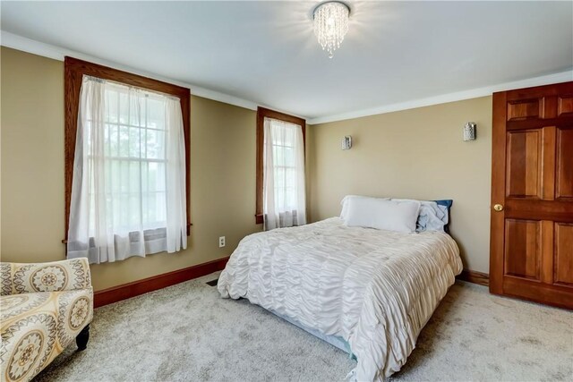 38 E Ave, Murray, NY 14470 - bedroom featuring light colored carpet, multiple windows, and crown molding