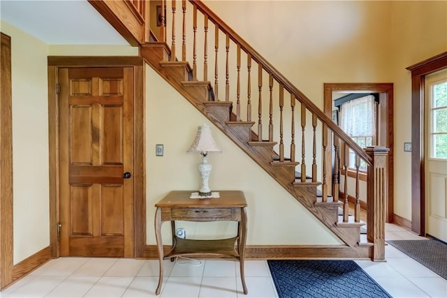38 E Ave, Murray, NY 14470 - stairs with baseboards and tile patterned floors