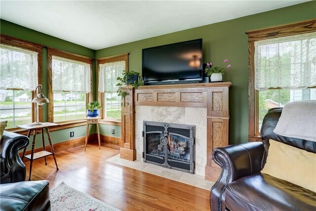 38 E Ave, Murray, NY 14470 - living area with a tile fireplace and wood finished floors