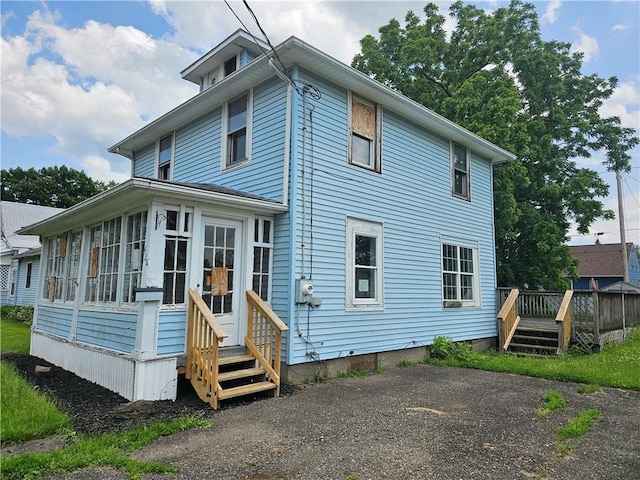 420 Schuyler Ave, Southport, NY 14904 - rear view of house featuring a deck and a sunroom