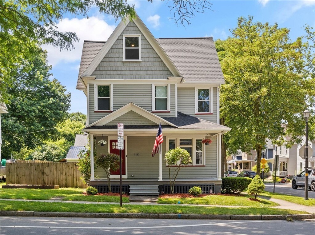 1133 Clinton Ave S, Rochester, NY 14620 - american foursquare style home featuring a porch and roof with shingles