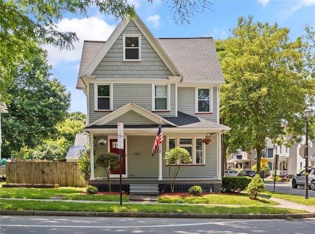 1133 Clinton Ave S, Rochester, NY 14620 - american foursquare style home featuring a porch and roof with shingles
