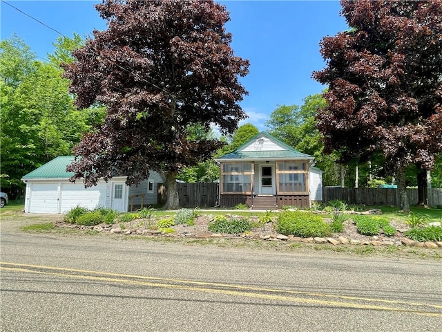 1663 Bingham Rd, Keating Town, PA 16726 - view of front of home featuring a detached garage, an outbuilding, and a metal roof