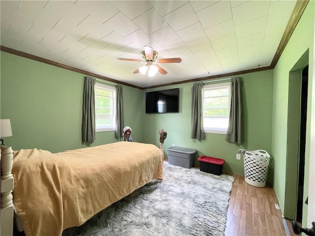 1663 Bingham Rd, Keating Town, PA 16726 - bedroom featuring crown molding, multiple windows, wood finished floors, and a ceiling fan