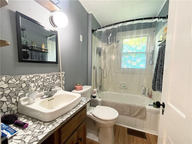 1663 Bingham Rd, Keating Town, PA 16726 - bathroom featuring wood finished floors, shower / bath combination with curtain, vanity, and backsplash