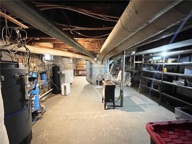 1663 Bingham Rd, Keating Town, PA 16726 - unfinished basement featuring heating unit, water heater, and a water softener system