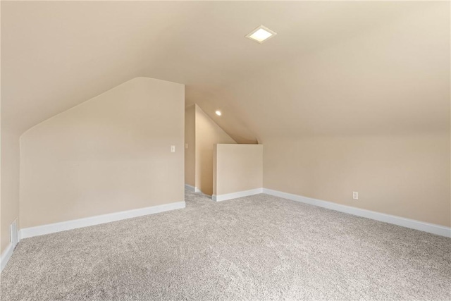 1617 Five Mile Line Rd, Penfield, NY 14526 - additional living space featuring light carpet, vaulted ceiling, and recessed lighting