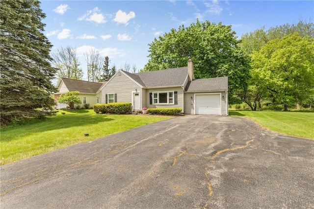 1617 Five Mile Line Rd, Penfield, NY 14526 - view of front of home with an attached garage, a chimney, asphalt driveway, and a front lawn