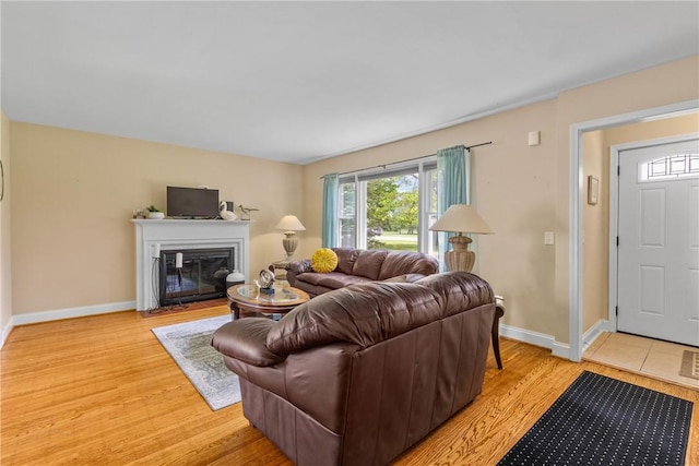 1617 Five Mile Line Rd, Penfield, NY 14526 - living area featuring light wood-type flooring and a fireplace with flush hearth