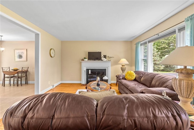 1617 Five Mile Line Rd, Penfield, NY 14526 - living room with a glass covered fireplace and baseboards