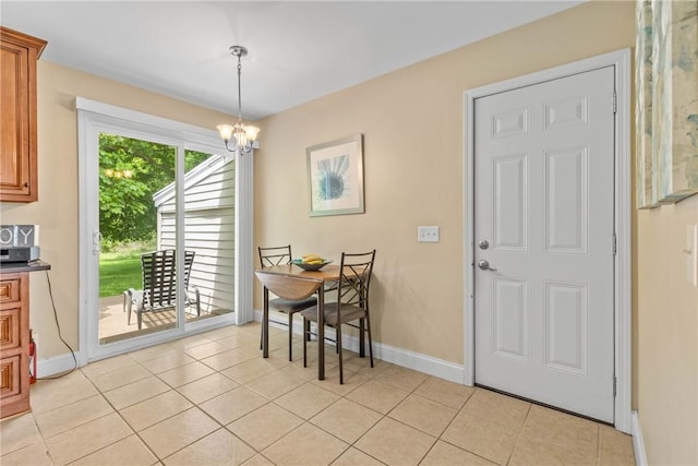 1617 Five Mile Line Rd, Penfield, NY 14526 - dining space featuring a chandelier and light tile patterned floors