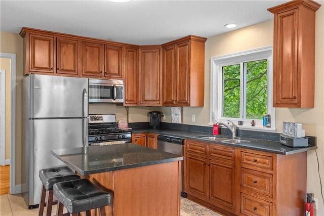 1617 Five Mile Line Rd, Penfield, NY 14526 - kitchen with appliances with stainless steel finishes, brown cabinets, dark stone counters, and recessed lighting