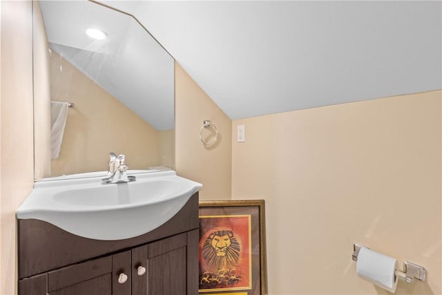 1617 Five Mile Line Rd, Penfield, NY 14526 - bathroom featuring vanity and lofted ceiling