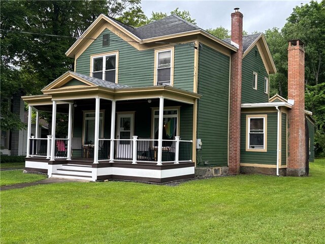 15 Water St, Worcester, NY 12197 - rear view of house featuring a porch, a chimney, a yard, and roof with shingles