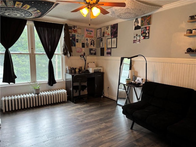 15 Water St, Worcester, NY 12197 - sitting room with radiator heating unit, ceiling fan, wainscoting, crown molding, and hardwood / wood-style floors