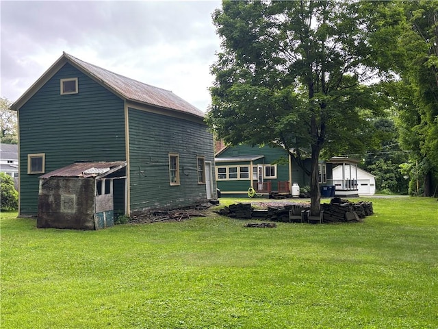 15 Water St, Worcester, NY 12197 - rear view of house with a lawn and an outbuilding