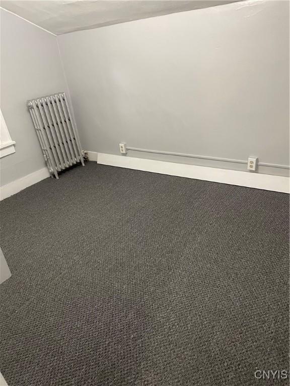 216 S 2nd St, Fulton, NY 13069 - unfurnished room with dark colored carpet and baseboards